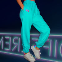 Model wearing the blue neon oversized jogger sweatpants for winter comfort