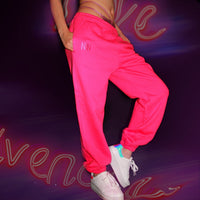 Model wearing the pink neon oversized jogger sweatpants for an afterparty