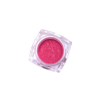 Red pink shimmer loose pigment eyeshadow on display, in a sweet treats color