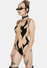 Model wearing the black flame mesh bodysuit for a burlesque glam look