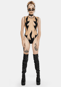 Model showing the black flame nude mesh bodysuit from another angle