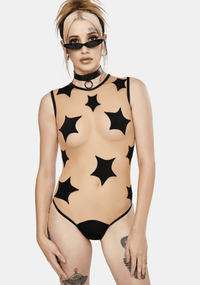 Model in the black star print nude mesh bodysuit, front view