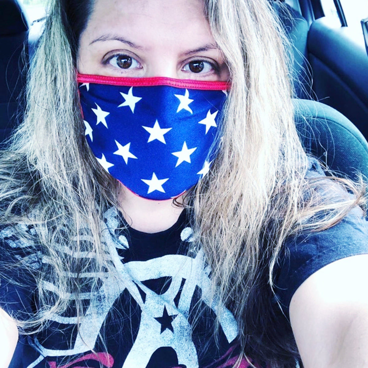 Model wearing blue and red star spangled face mask for a finished look