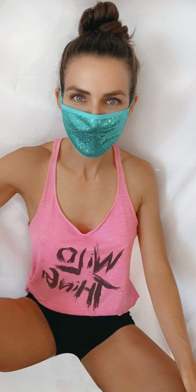 Model in the turquoise sequin face mask for a mermaid party look