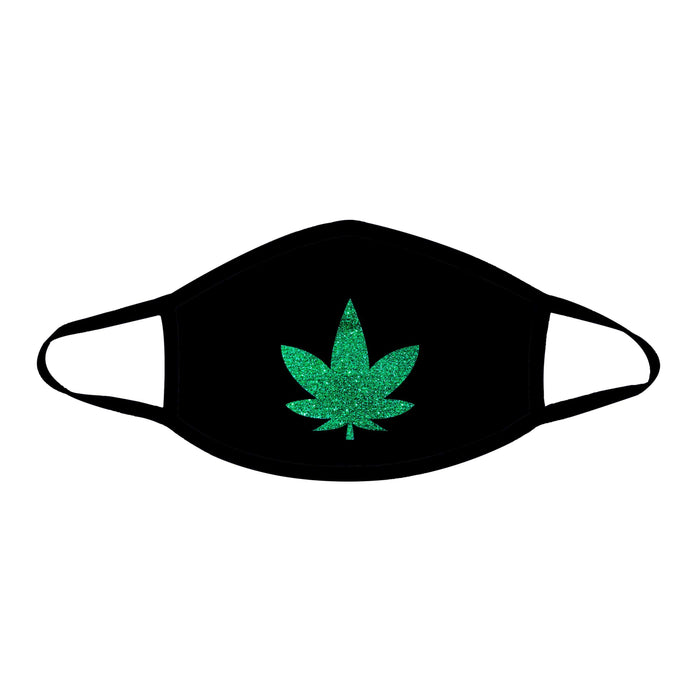 Black face mask with a green glitter weed leaf shown on a clean background
