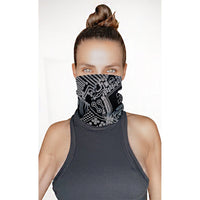 Model wearing the black white reflective circuit neck gaiter as a face cover