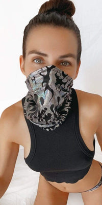 Model in the black holographic flame neck gaiter for a cyberpunk look