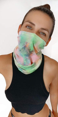 Model in the pastel rainbow tie dye velvet neck gaiter at a rave