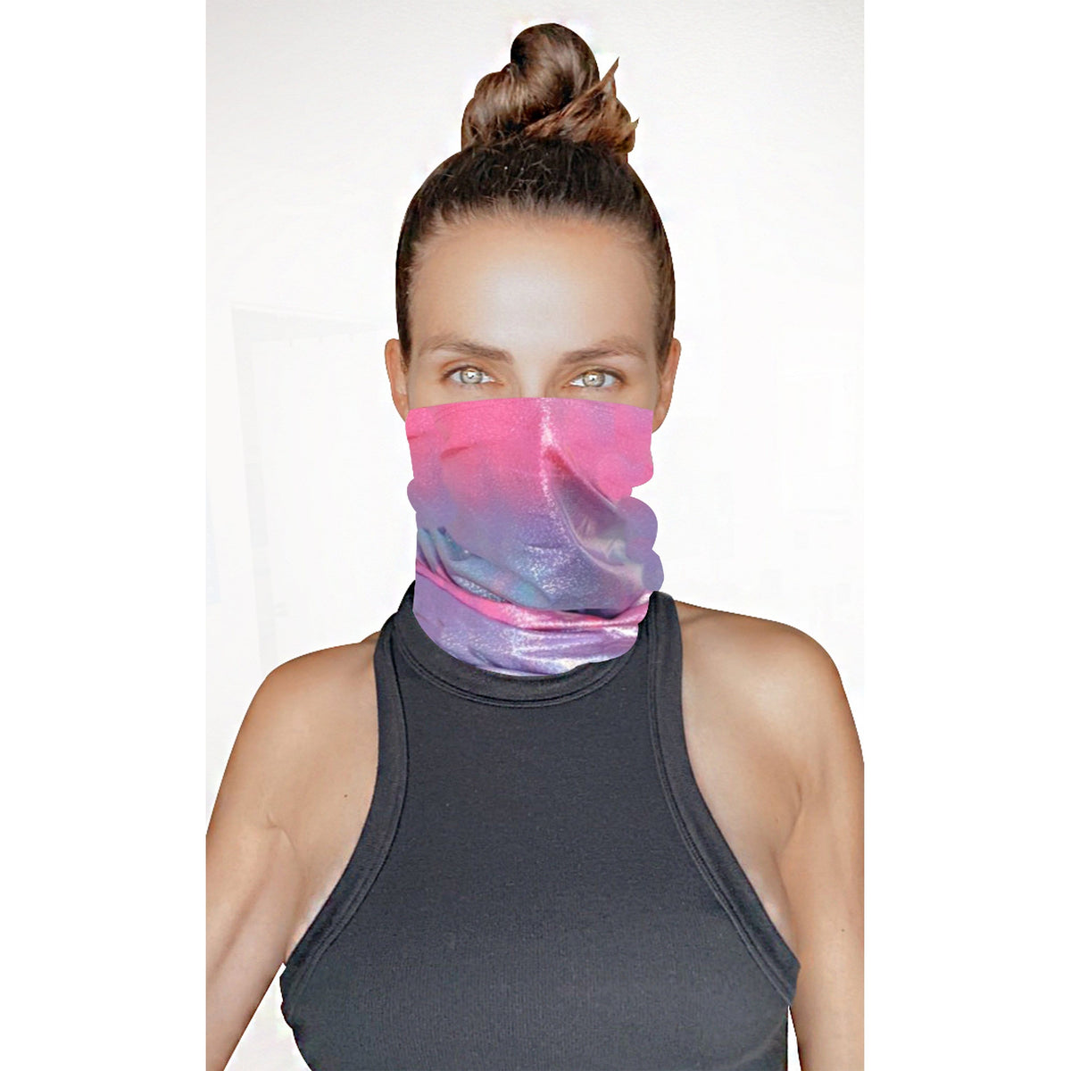 Model wearing the pink blue holographic neck gaiter as a face cover