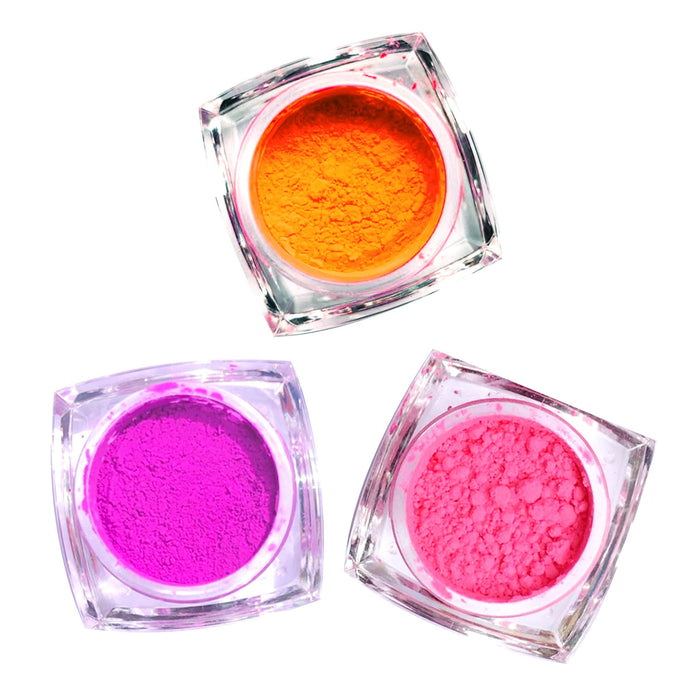 Neon pink, orange and purple UV loose pigments for a bright rave makeup kit