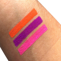Neon purple loose pigment eyeshadow on display, that pops under blacklight