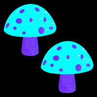 Pink and white glitter mushroom nipple pasties shown on their own for a blacklight rave