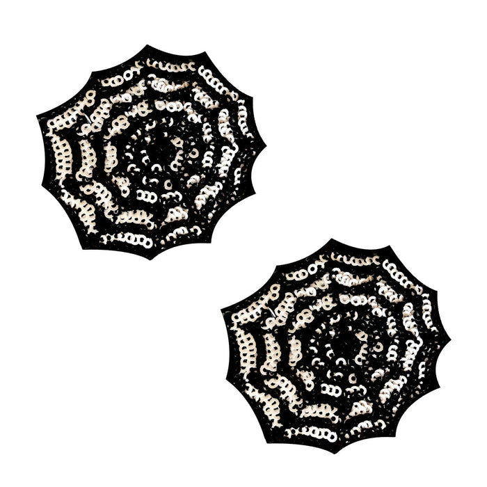 Black sequin spiderweb nipple pasties with a glowing blacklight web design