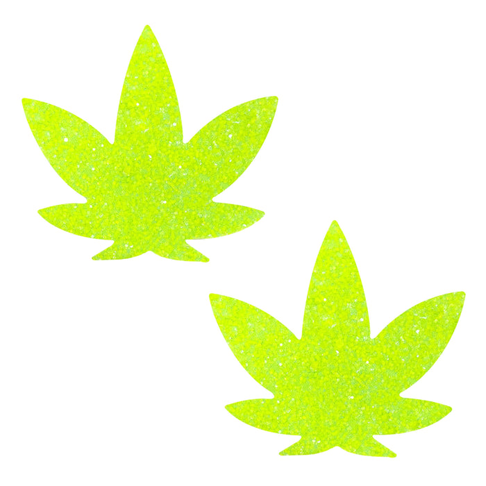 Lemon lime blacklight glitter weed leaf nipple pasties shown on a clean background