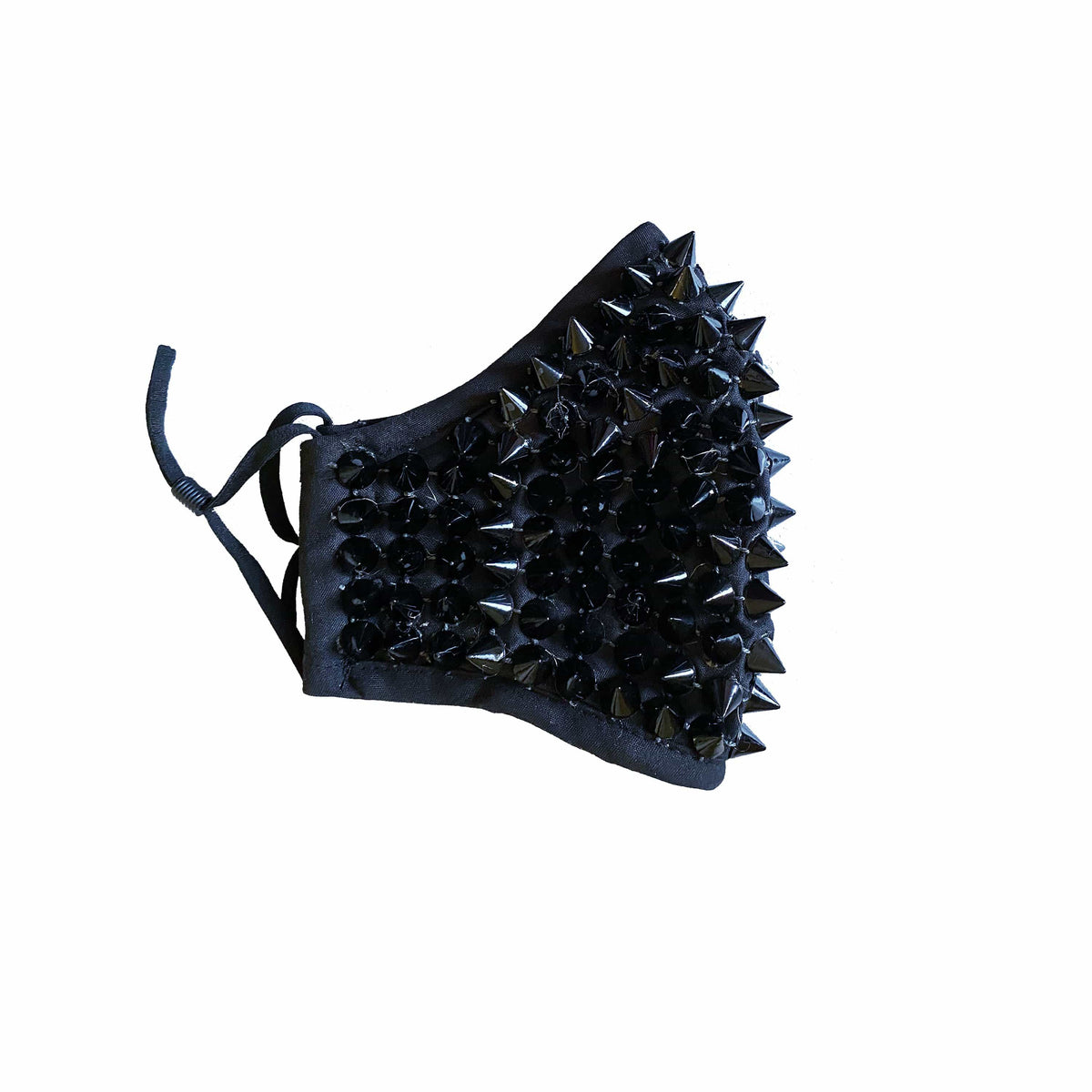 Side view of the black studded face mask with silver spikes and adjustable loops