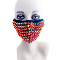 Side view of the red studded face mask from the pastie and pantie set