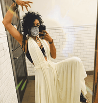 Model wearing the silver chrome studded face mask with filter pocket