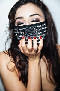Model rocking the shiny silver chrome studded mask at a rave