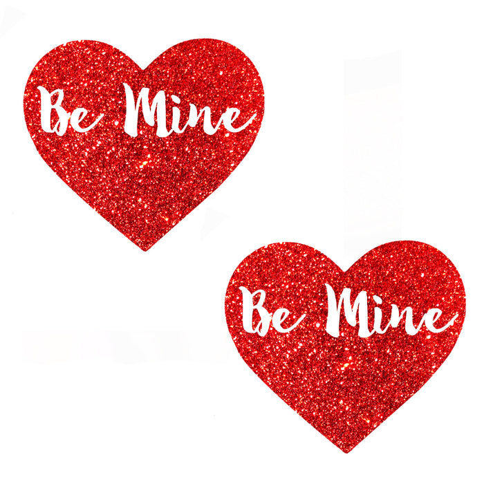 Red glitter blacklight heart shaped nipple pasties for a Valentine date