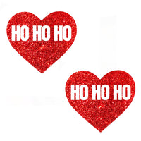 Red reflective glitter heart nipple pasties shown on a clean background