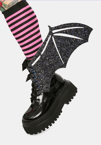 Model showing off the black glitter bat boot wings for Halloween