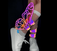 Model wearing the rainbow reflective butterfly wings on her boots