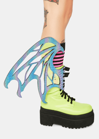 Model showing off the purple dragon scale wings on her boots