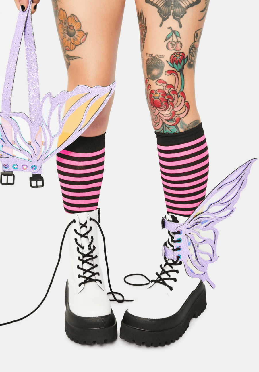 Model wearing the lilac glitter fairy wings on her boots for a pastel pixie look