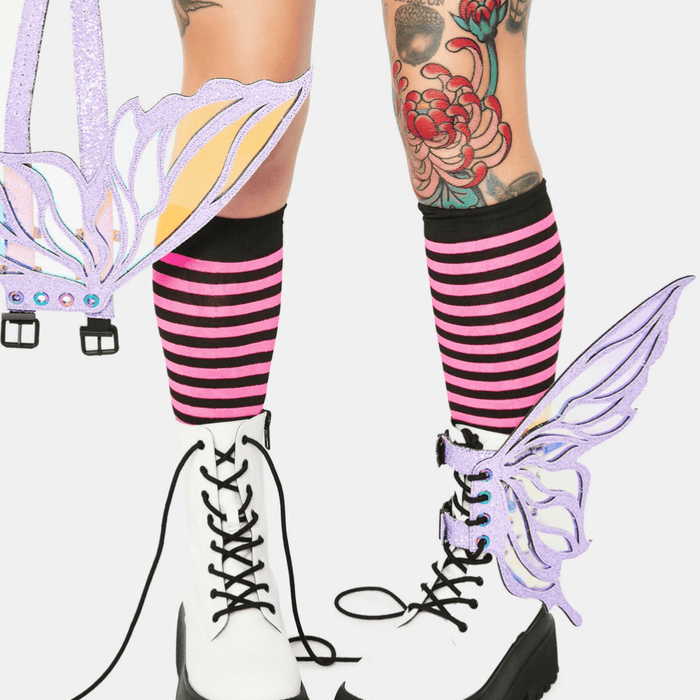 Model wearing the lilac glitter fairy wings on her boots for a pastel pixie look