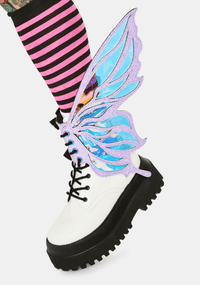 Model showing off the lilac glitter fairy boot wings, pastel pixie look