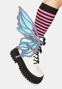 Model showing off the dark purple fairy boot wings at a festival