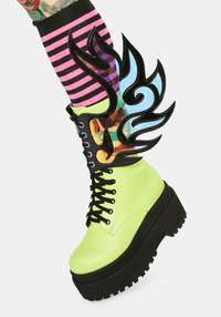Model showing off the iridescent flame boot wings at a rally