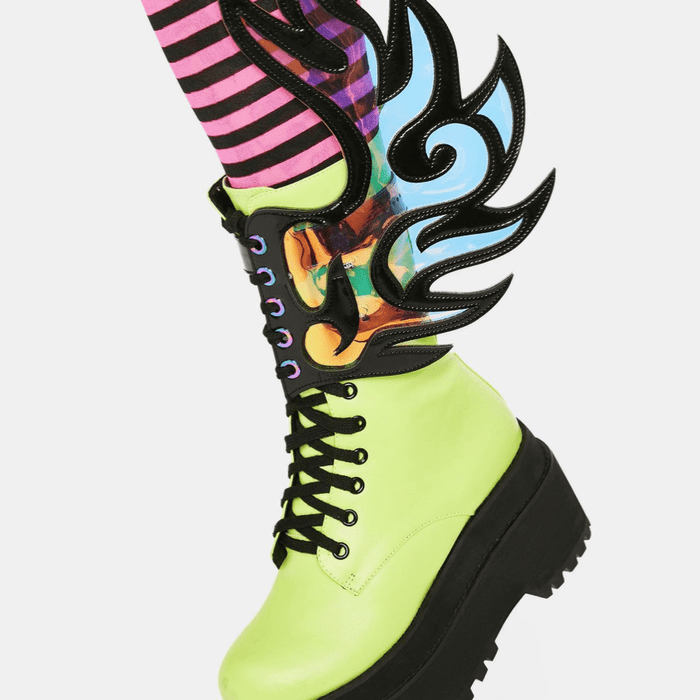 Model showing off the iridescent flame boot wings at a rally