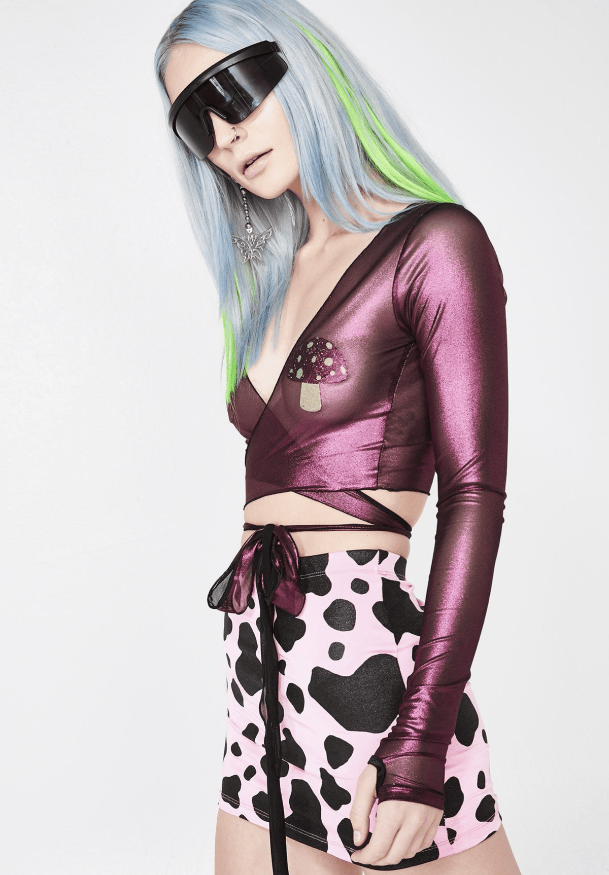Pink glitter UV mushroom nipple pasties worn by a model for a psychedelic rave look