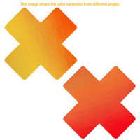 Orange yellow color changing X nipple pasties, showing the color, finish and shape of the design
