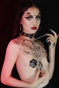 Rebel night goth look built from black temporary tattoos, crystals and a choker